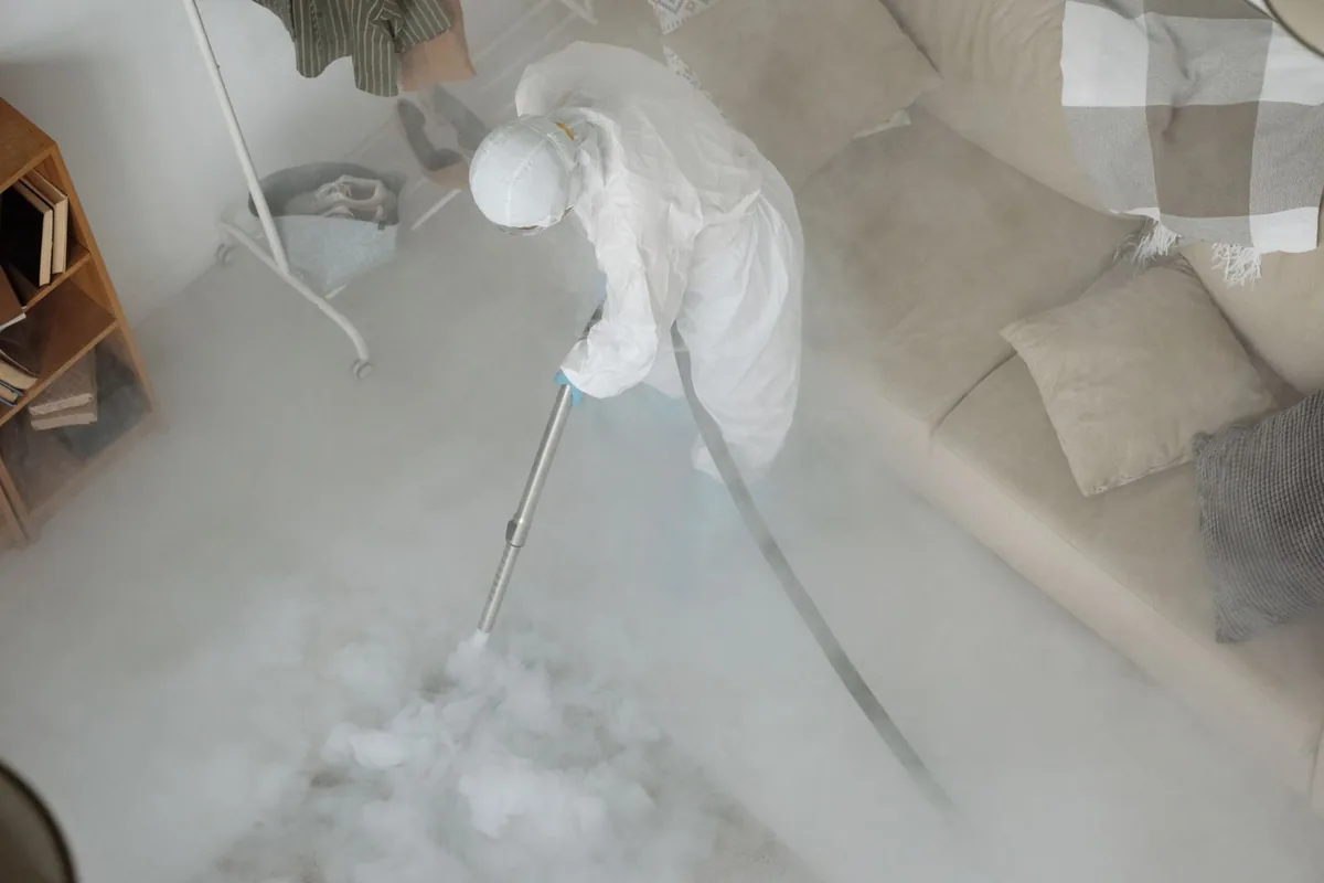 Biohazard cleanup technician in protective equipment, Layton, UT